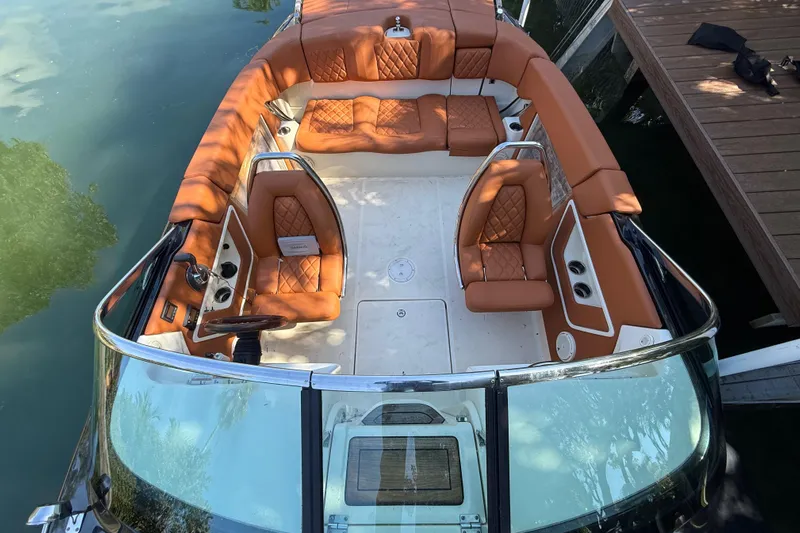  Yacht Photos Pics 2018 Chris-Craft Capri 27 boat with luxurious tan leather seating and sleek design.