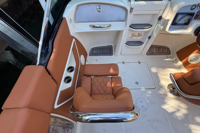  Yacht Photos Pics Interior of a 2018 Chris-Craft Capri 27 with brown leather seats.