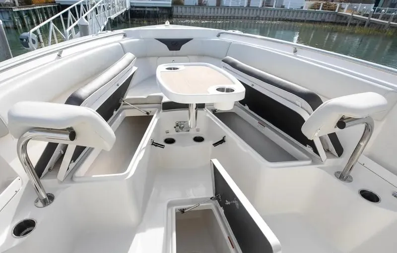  Yacht Photos Pics 2022 Sailfish 290 CC boat interior with seating and storage compartments.