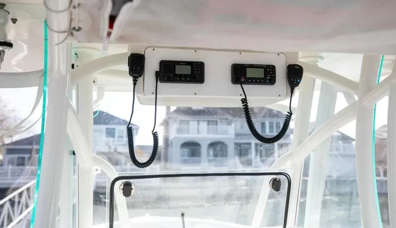  Yacht Photos Pics 2022 Sailfish 290 CC boat dashboard with communication equipment.