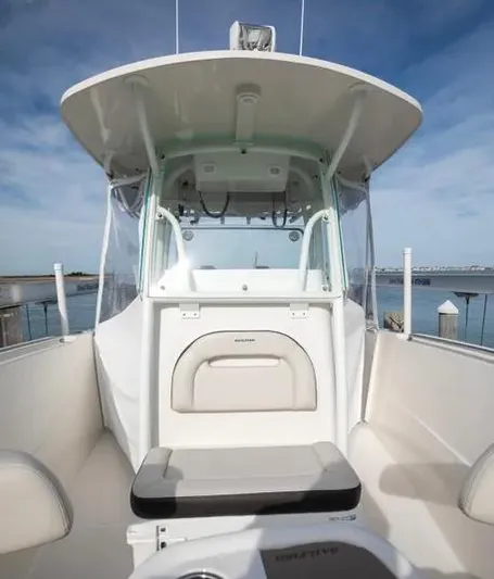  Yacht Photos Pics 2022 Sailfish 290 CC boat interior with helm, seating, and ocean view.
