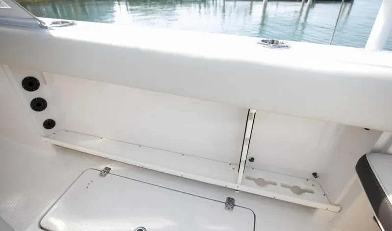  Yacht Photos Pics 2022 Sailfish 290 CC boat interior with storage compartments and rod holders.