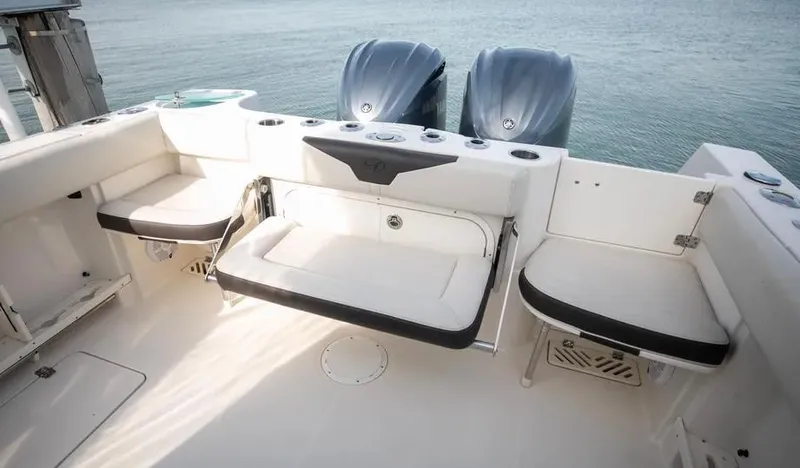  Yacht Photos Pics 2022 Sailfish 290 CC boat interior with seating and dual engines.