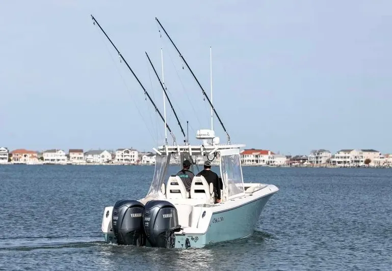  Yacht Photos Pics 2022 Sailfish 290 CC boat with dual Yamaha engines on calm water.