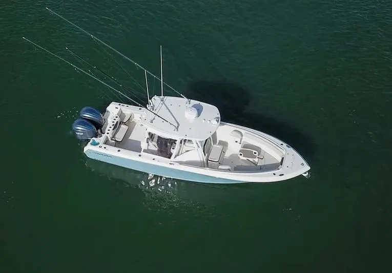  Yacht Photos Pics Aerial view of 2022 Sailfish 290 CC boat on calm water.