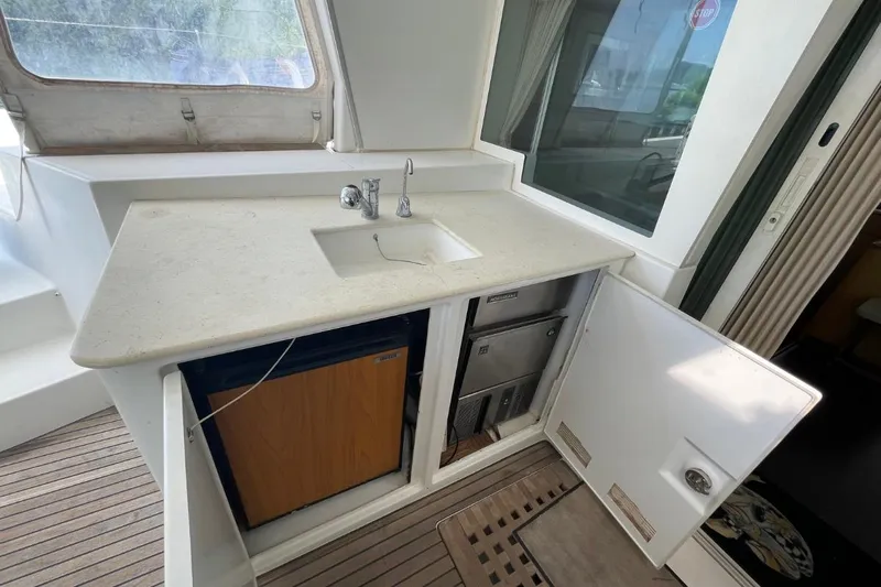 Tikiaora Yacht Photos Pics Lagoon 500 yacht kitchenette with sink, fridge, and storage, 2008 model.