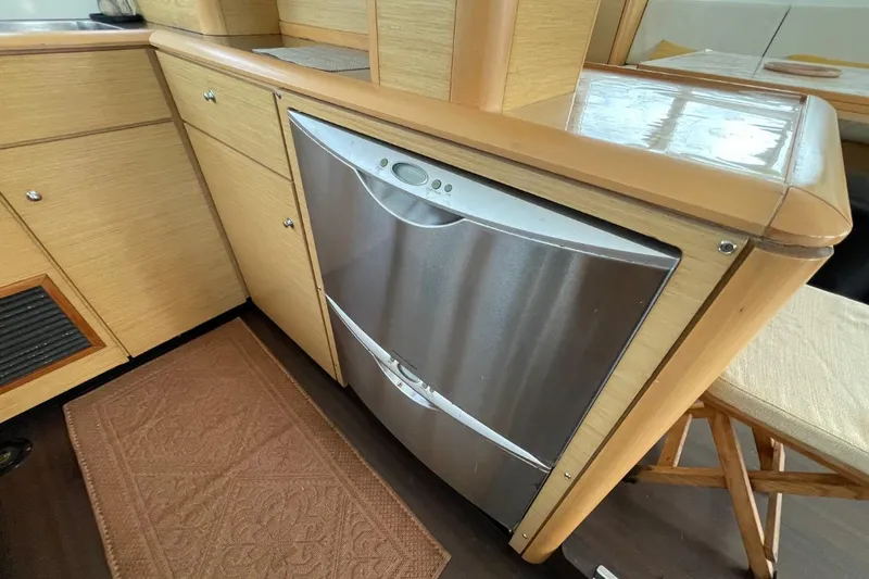 Tikiaora Yacht Photos Pics Modern kitchen area in a 2008 Lagoon 500 yacht with stainless steel dishwasher.