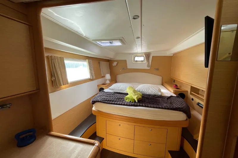 Tikiaora Yacht Photos Pics Luxurious cabin interior of 2008 Lagoon 500 yacht with cozy bed and natural light.