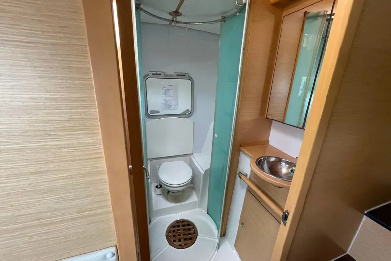 Tikiaora Yacht Photos Pics Bathroom interior of 2008 Lagoon 500 yacht with shower, toilet, and sink.