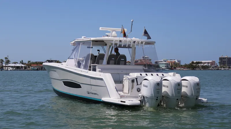  Yacht Photos Pics 2022 Regal 38 SAV boat with four Yamaha engines on a sunny day.