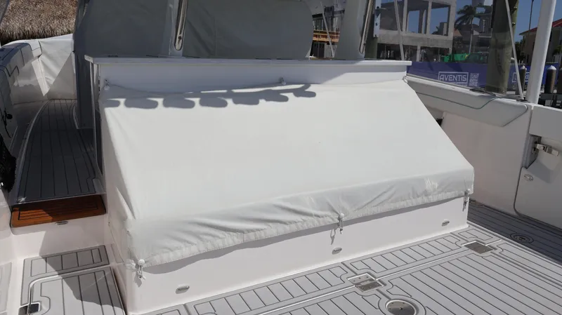  Yacht Photos Pics 2022 Regal 38 SAV boat with covered seating area on deck.