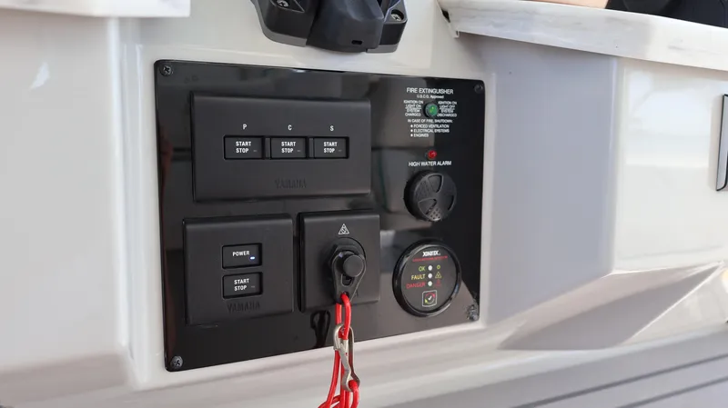  Yacht Photos Pics Control panel of 2022 Regal 38 SAV boat with ignition switches and safety features.