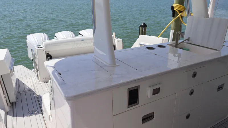  Yacht Photos Pics 2022 Regal 38 SAV boat with sleek deck and powerful engines on water.