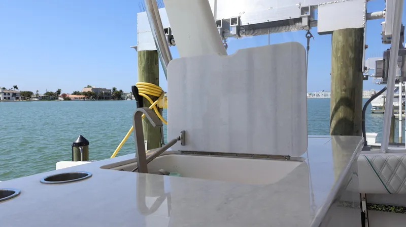  Yacht Photos Pics 2022 Regal 38 SAV boat interior with sink, docked by the water.