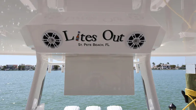  Yacht Photos Pics Regal 38 SAV boat with "Lites Out" sign, St. Pete Beach, FL, 2022 model.