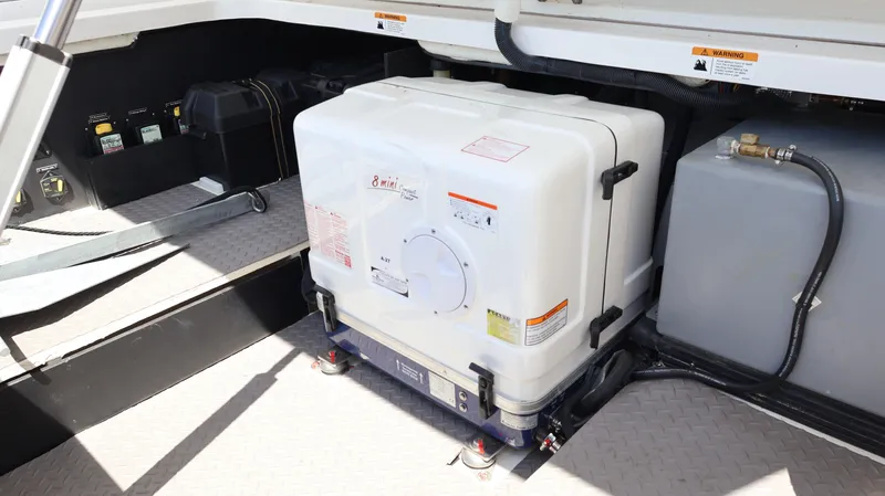  Yacht Photos Pics 2022 Regal 38 SAV boat engine compartment with generator and equipment.