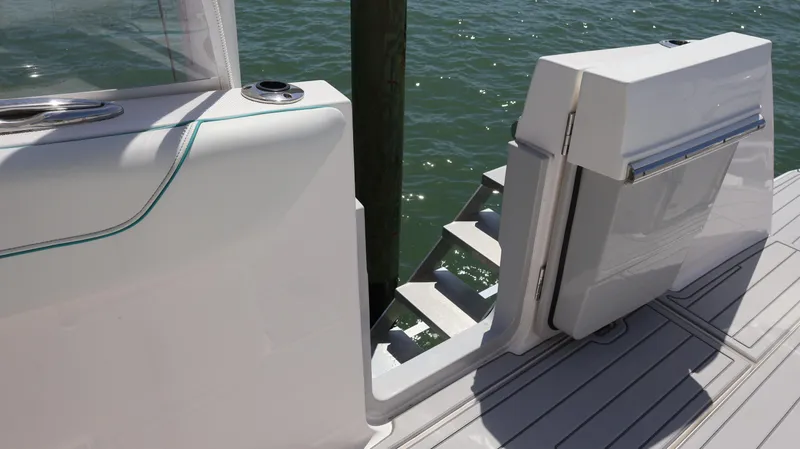  Yacht Photos Pics 2022 Regal 38 SAV boat with open side door and steps leading to water.