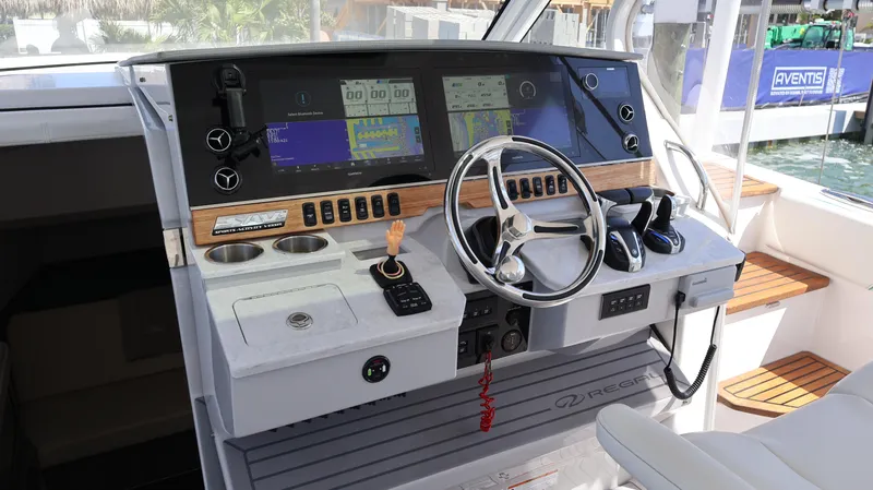  Yacht Photos Pics 2022 Regal 38 SAV helm with modern controls and navigation displays.