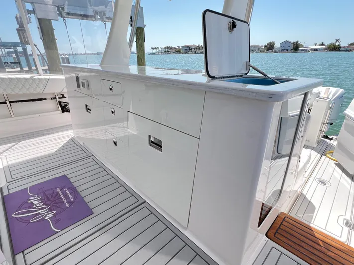  Yacht Photos Pics 2022 Regal 38 SAV yacht interior with sleek cabinetry and ocean view.