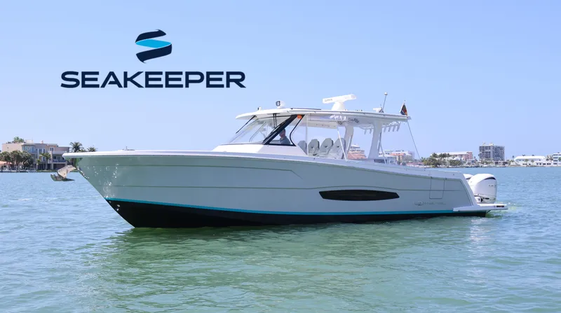  Yacht Photos Pics 2022 Regal 38 SAV boat on water with Seakeeper logo.