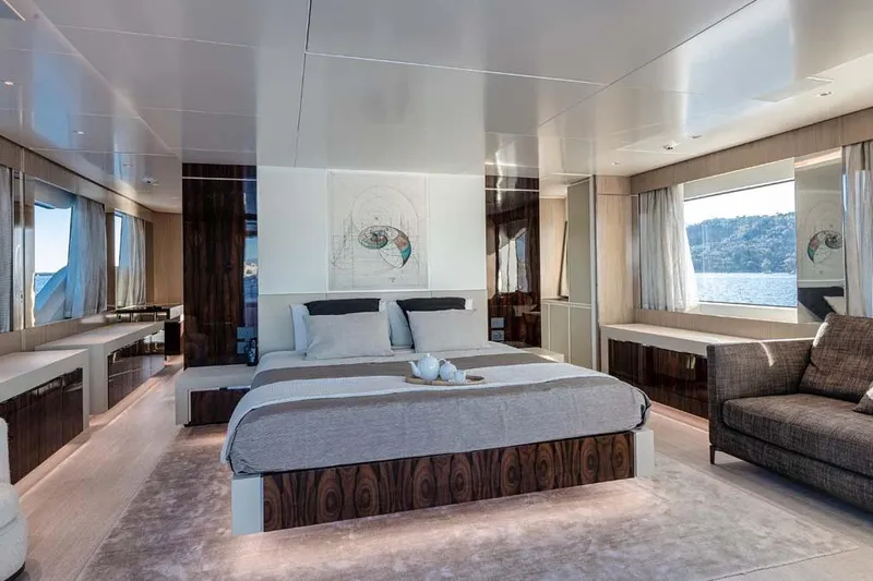 Oceanic 143 Yacht Photos Pics Luxurious 2023 Canados Expedition Yacht bedroom with modern decor and scenic ocean view.