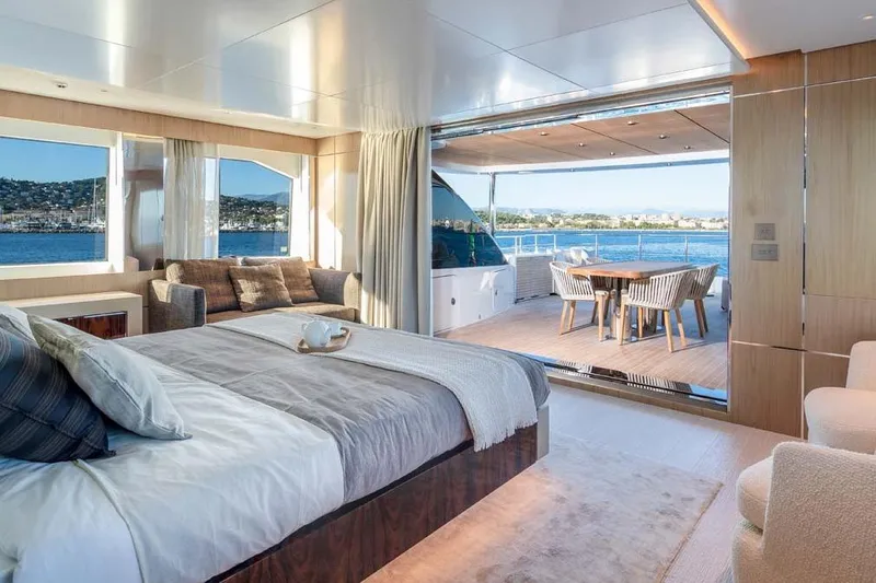 Oceanic 143 Yacht Photos Pics Luxurious 2023 Canados Expedition Yacht interior with ocean view, featuring elegant bedroom and dining area.
