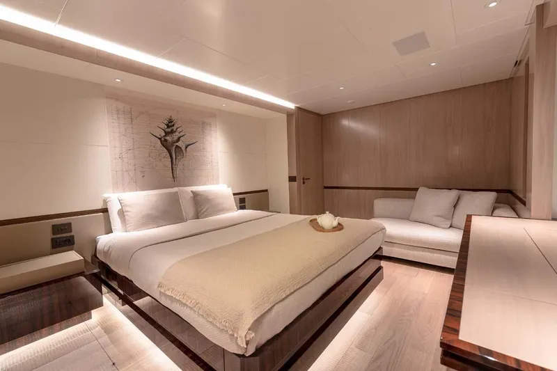 Oceanic 143 Yacht Photos Pics Luxurious bedroom interior of 2023 Canados Expedition Yacht with modern design and cozy ambiance.
