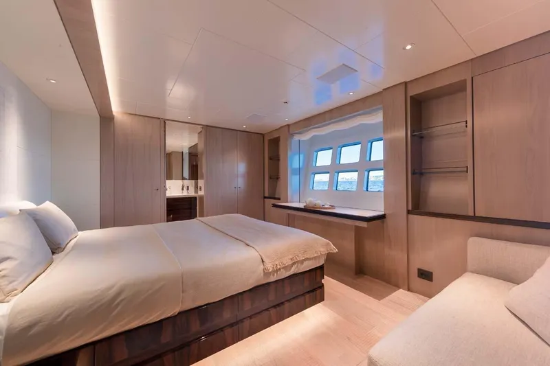 Oceanic 143 Yacht Photos Pics Luxurious bedroom interior of 2023 Canados Expedition Yacht with modern design and ocean view.