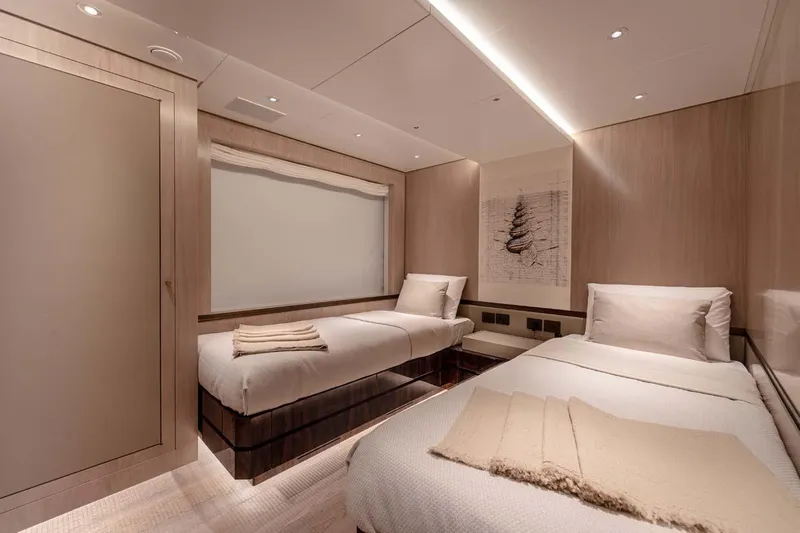 Oceanic 143 Yacht Photos Pics Luxurious twin bedroom in 2023 Canados Expedition Yacht, featuring modern design and cozy ambiance.
