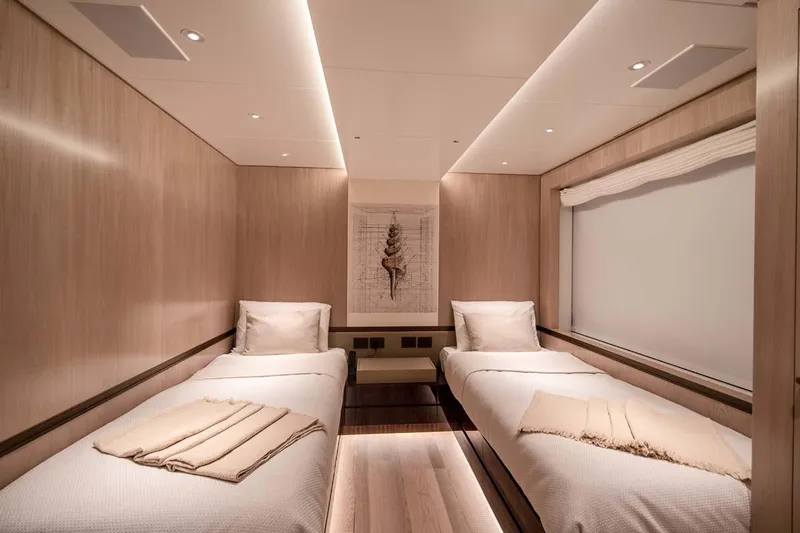 Oceanic 143 Yacht Photos Pics Luxurious twin cabin interior of 2023 Canados Expedition Yacht, featuring modern design and cozy ambiance.
