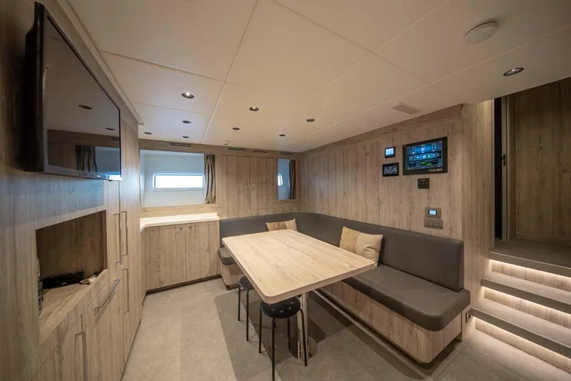 Oceanic 143 Yacht Photos Pics Luxurious interior of 2023 Canados Expedition Yacht with modern seating and control panels.