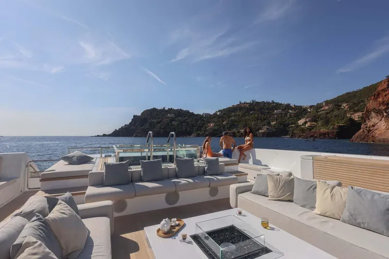 Oceanic 143 Yacht Photos Pics Luxurious 2023 Canados Expedition Yacht with spacious deck, scenic coastal view, and elegant seating.