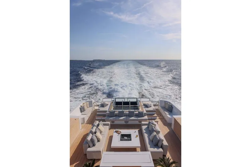 Oceanic 143 Yacht Photos Pics Luxurious 2023 Canados Expedition Yacht cruising with elegant outdoor seating and ocean view.