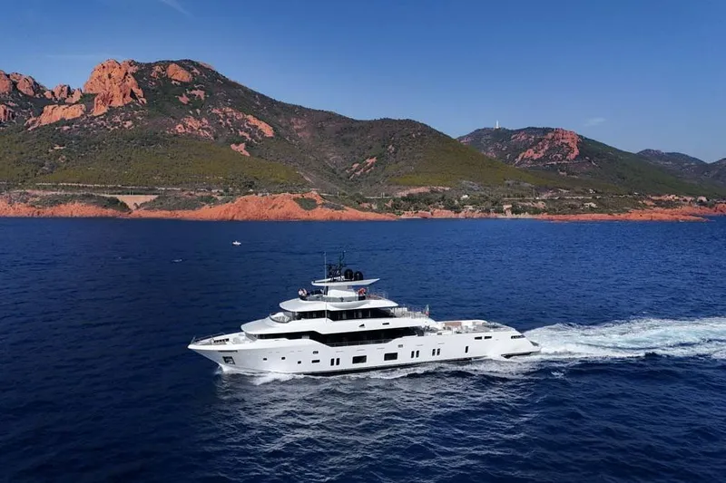 Oceanic 143 Yacht Photos Pics 2023 Canados Expedition Yacht cruising near scenic coastal mountains.