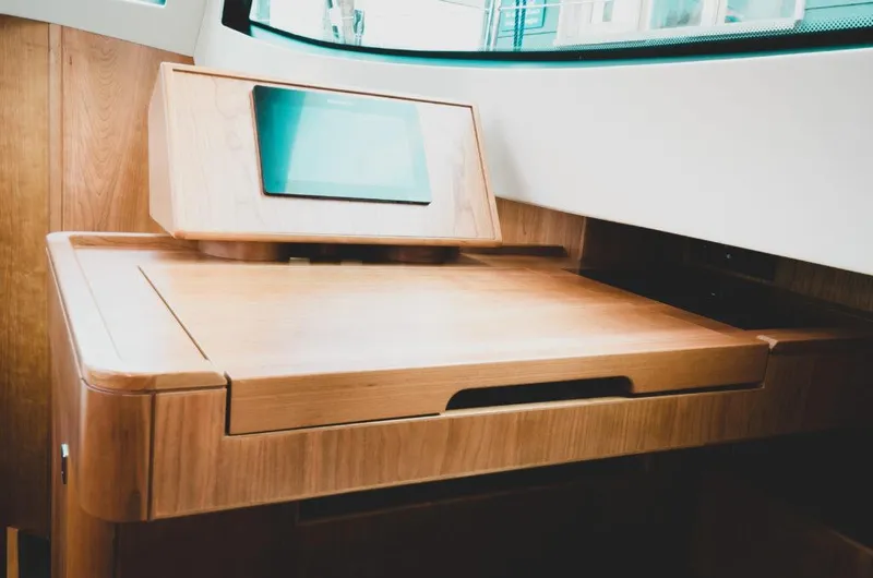 New Boat Built To Order Yacht Photos Pics Wooden navigation desk with screen on Southerly 480 yacht, 2025 model.