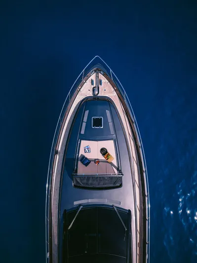  Yacht Photos Pics Aerial view of 2006 Riva 68 Ego yacht on deep blue water.