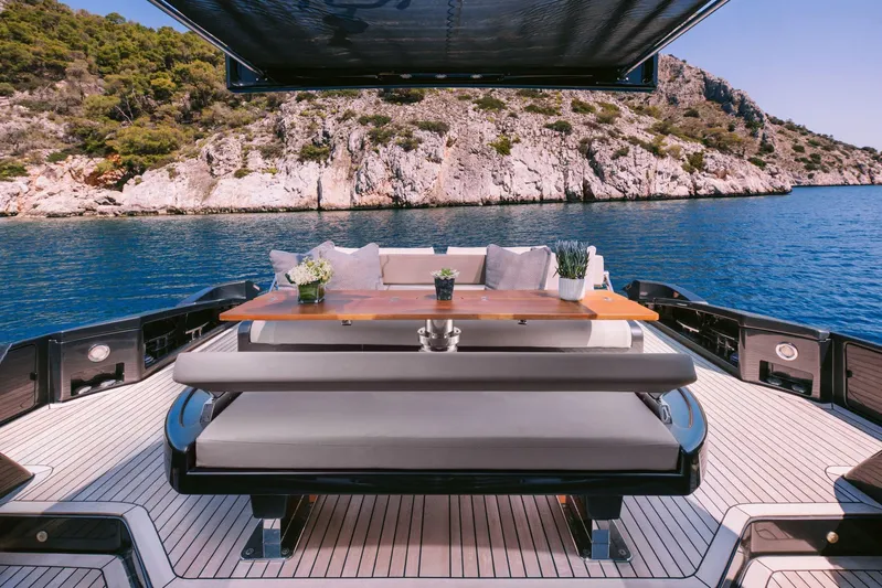  Yacht Photos Pics Luxurious 2006 Riva 68 Ego yacht with elegant outdoor seating and scenic ocean view.