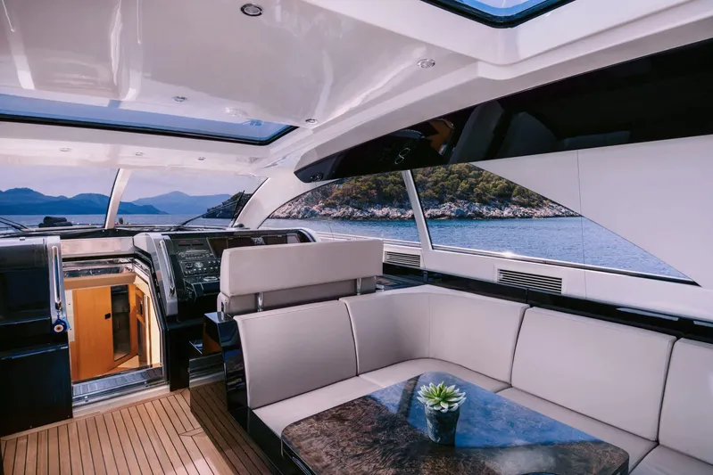  Yacht Photos Pics Luxurious interior of 2006 Riva 68 Ego yacht with scenic ocean view.