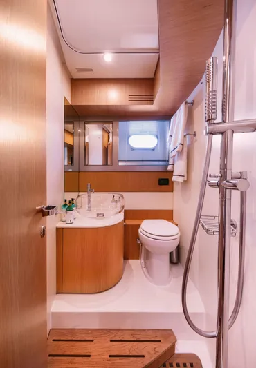  Yacht Photos Pics Luxurious bathroom in 2006 Riva 68 Ego yacht, featuring modern fixtures and elegant wood accents.