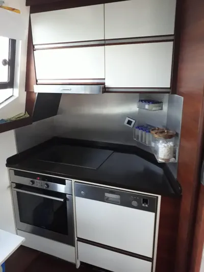  Yacht Photos Pics Compact kitchen on 2008 Numarine 78 Fly yacht.