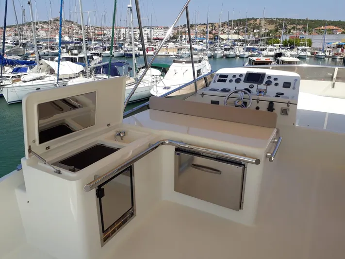  Yacht Photos Pics Numarine 78 Fly 2008 yacht with helm station and marina view.