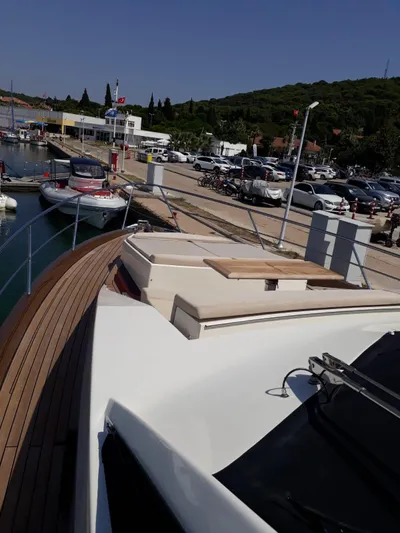  Yacht Photos Pics Numarine 78 Fly 2008 yacht docked in harbor, sunny day.