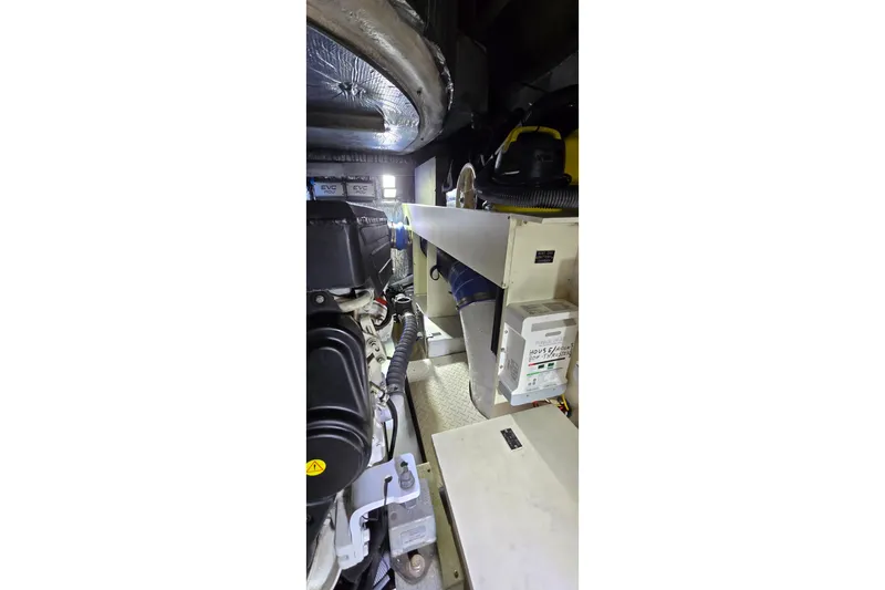  Yacht Photos Pics Engine room of 2006 Cruisers Yachts 520 Express, showcasing mechanical components.