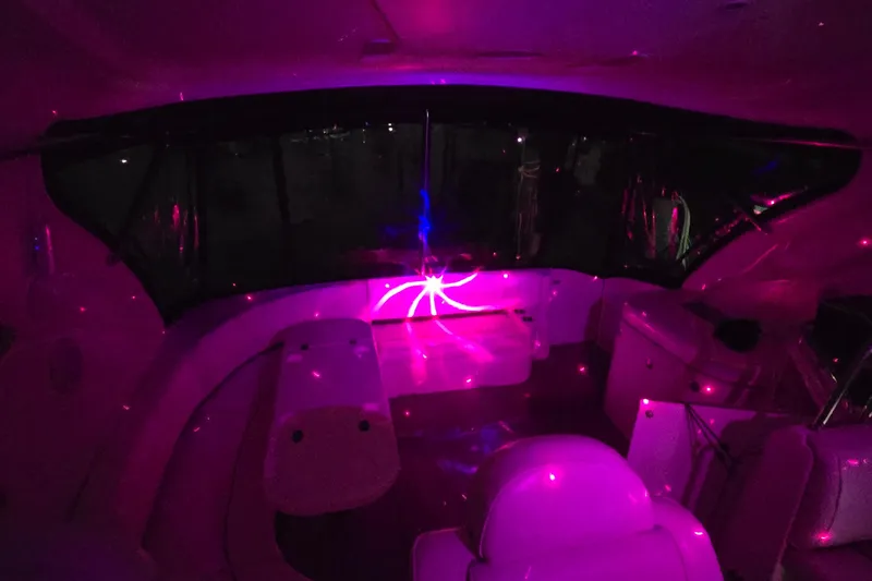  Yacht Photos Pics 2006 Cruisers Yachts 520 Express interior with vibrant pink lighting effects.