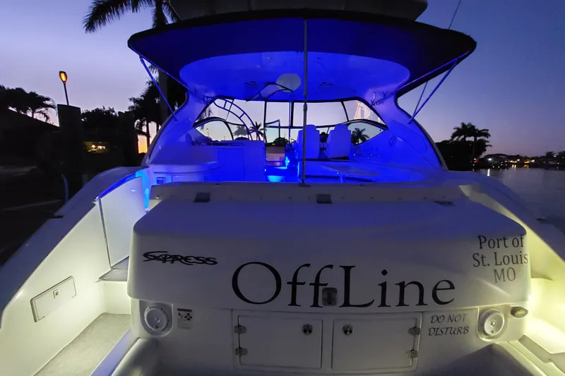  Yacht Photos Pics 2006 Cruisers Yachts 520 Express at dusk, illuminated with blue lights, docked in St. Louis.