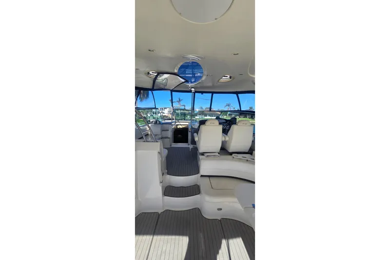  Yacht Photos Pics Interior view of 2006 Cruisers Yachts 520 Express, featuring spacious seating and helm area.