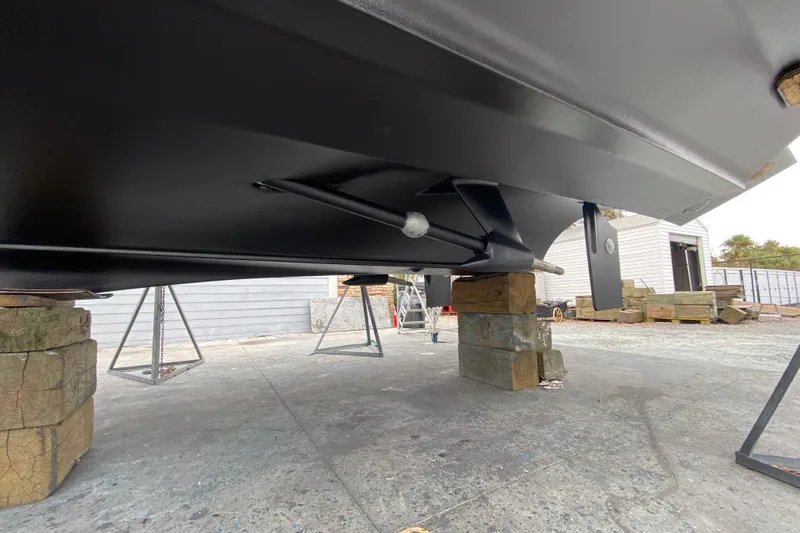  Yacht Photos Pics 2006 Cruisers Yachts 520 Express hull on blocks, showcasing underside details.