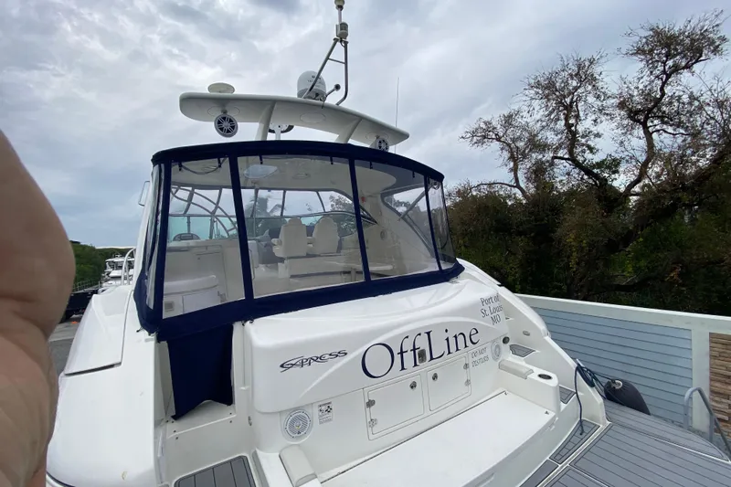  Yacht Photos Pics 2006 Cruisers Yachts 520 Express docked, rear view with canopy and seating area.