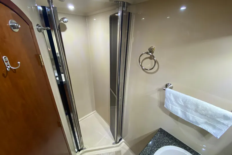  Yacht Photos Pics Luxurious bathroom in 2006 Cruisers Yachts 520 Express with shower and towel rack.