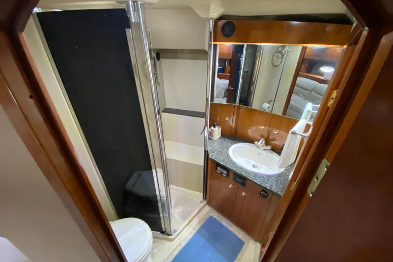  Yacht Photos Pics Luxurious bathroom in 2006 Cruisers Yachts 520 Express, featuring shower and vanity.
